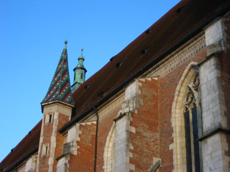 the steeples of this church are dotted with stone