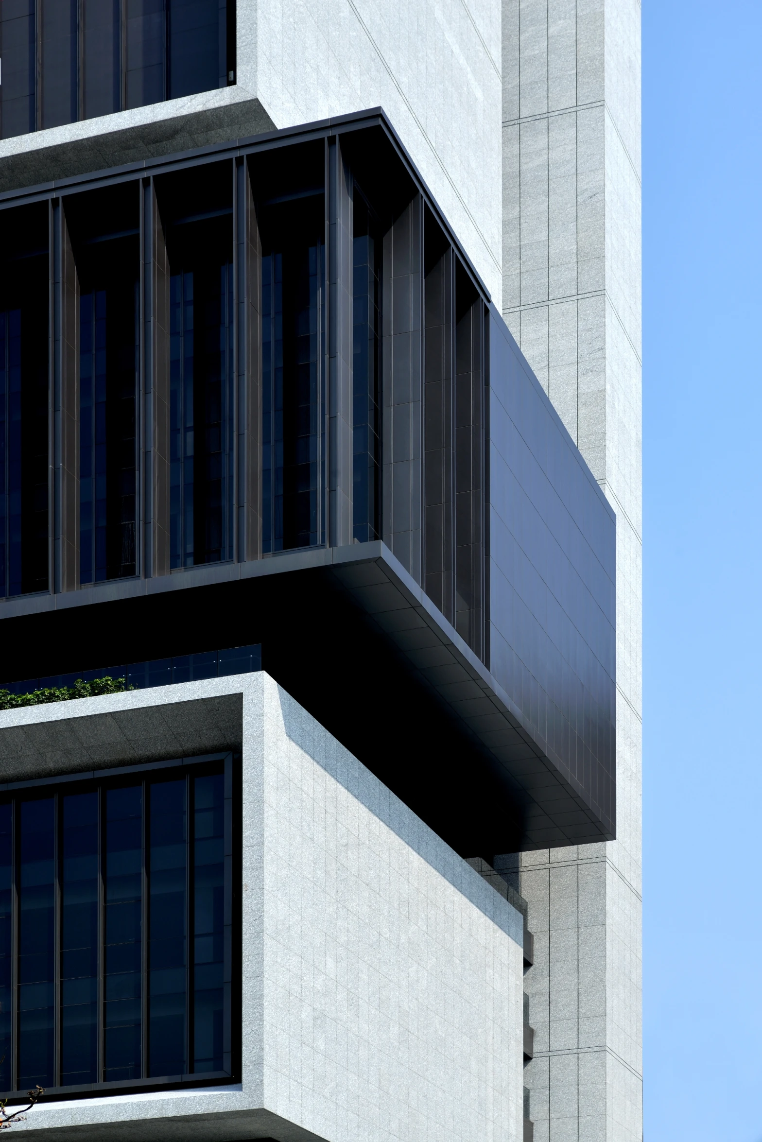 an image of the side of a building that is grey