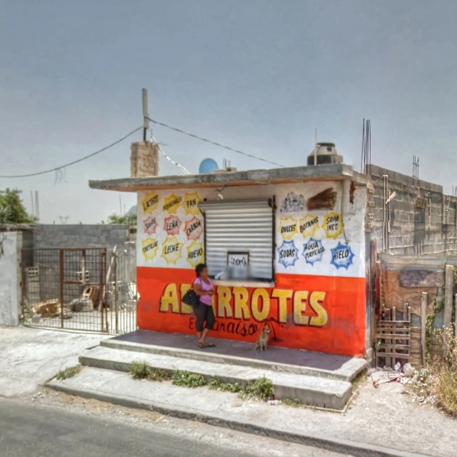 a woman sitting at a closed window of a restaurant