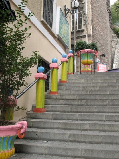 several colorful columns sitting on top of steps