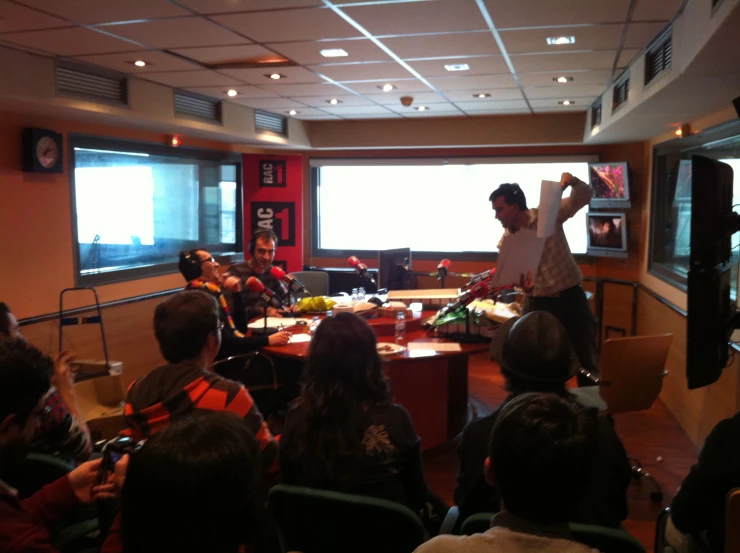 a person giving a presentation to a group of people