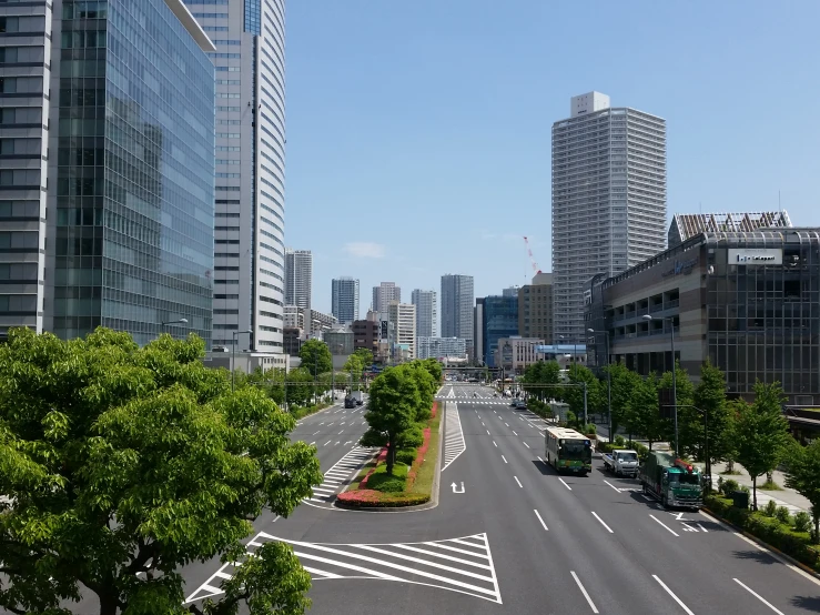 an empty road surrounded by tall buildings