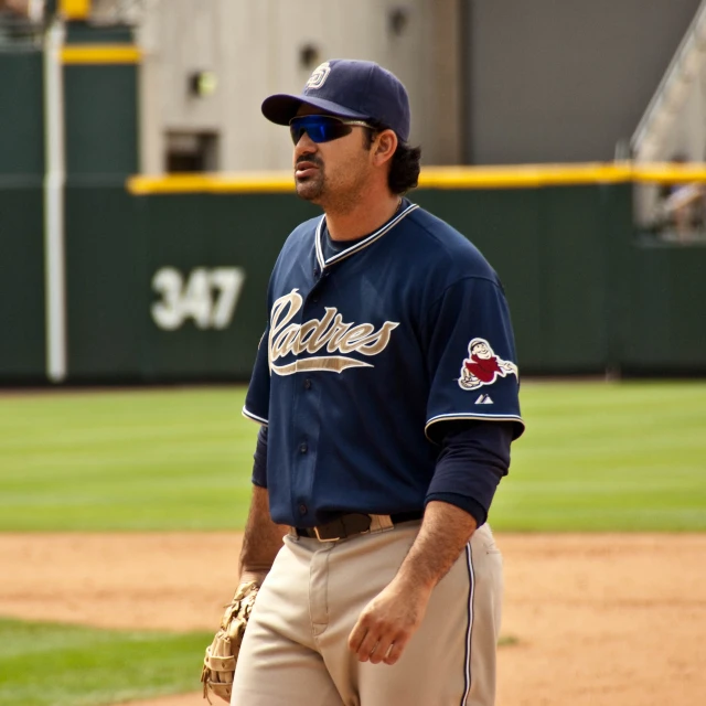 a baseball player is in the process of giving instructions on how to throw a ball