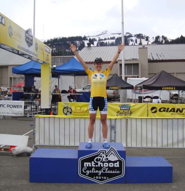 a man standing on top of a blue and white platform