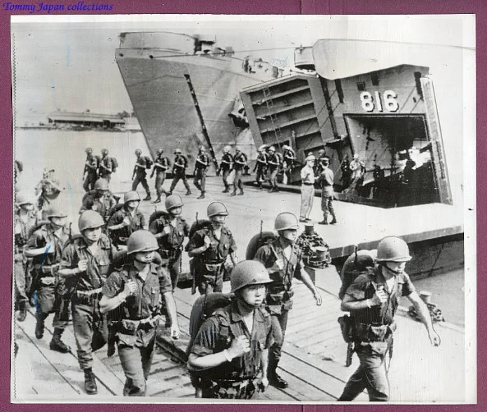 a group of soldiers and children walking on a dock