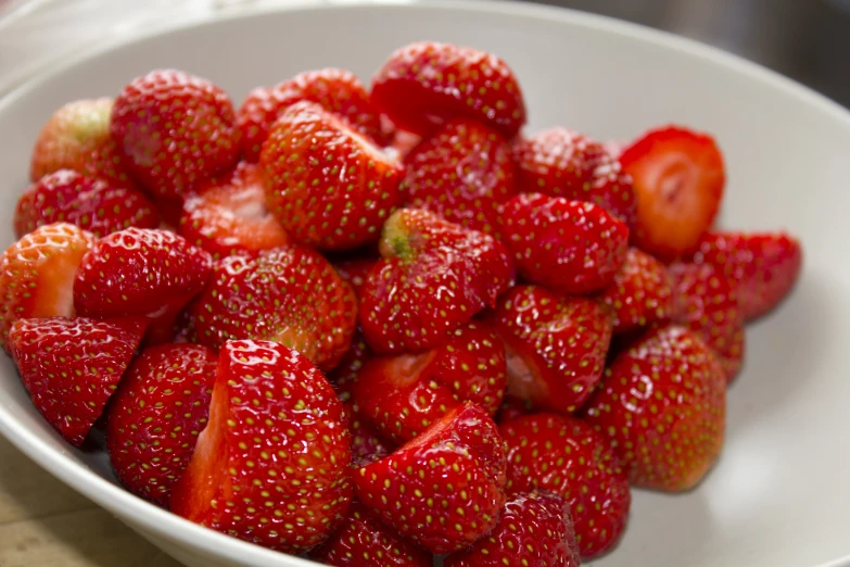 a bowl with some strawberries inside of it