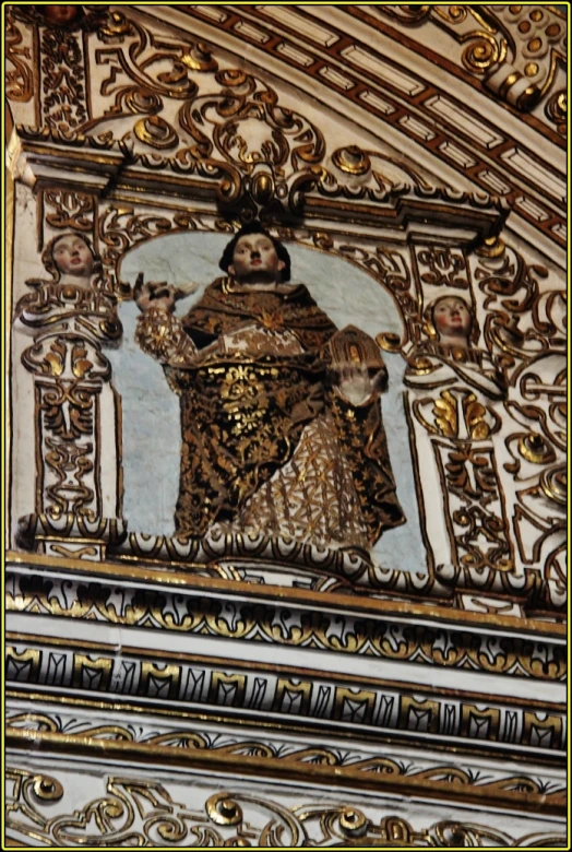 decorative panel depicting the statue of the virgin mary of guadalupe