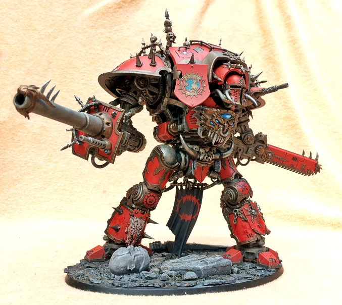 a big red and black warhammer with two guns