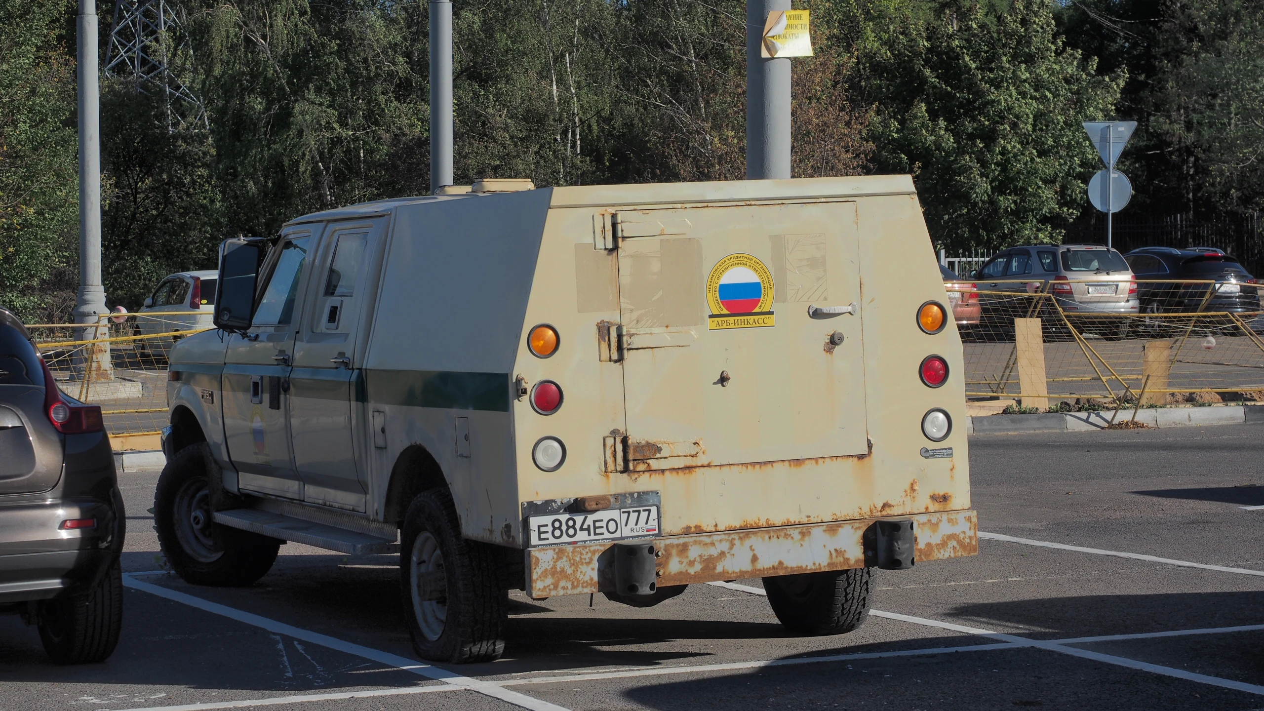 a military vehicle sitting in a parking lot