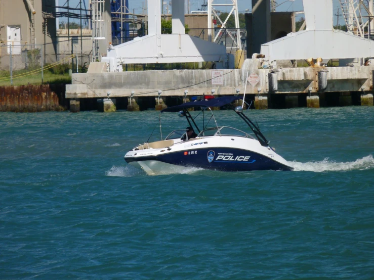 a police boat traveling on top of water