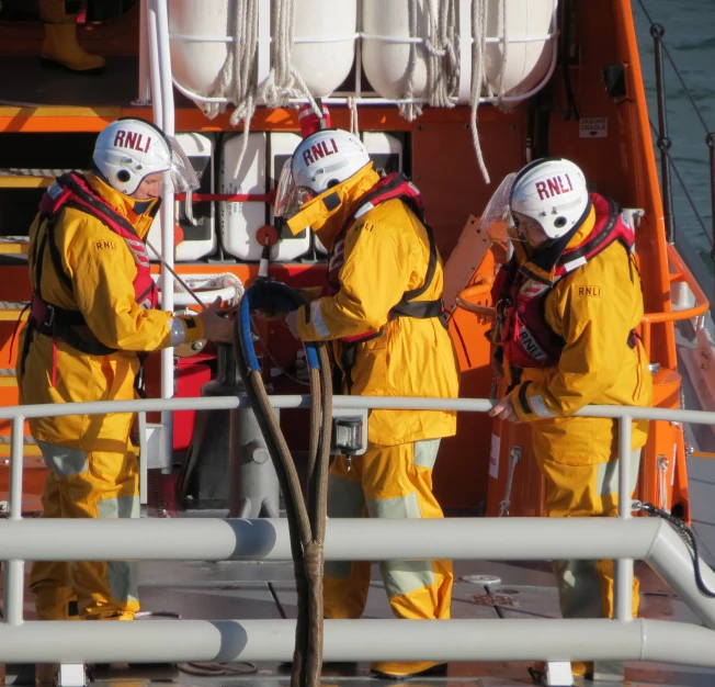 a group of fire fighters getting their gear on