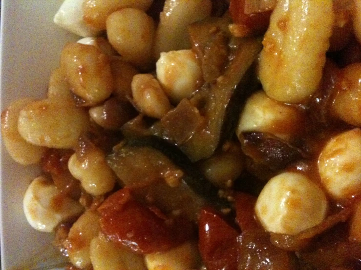 a large container filled with meat and beans