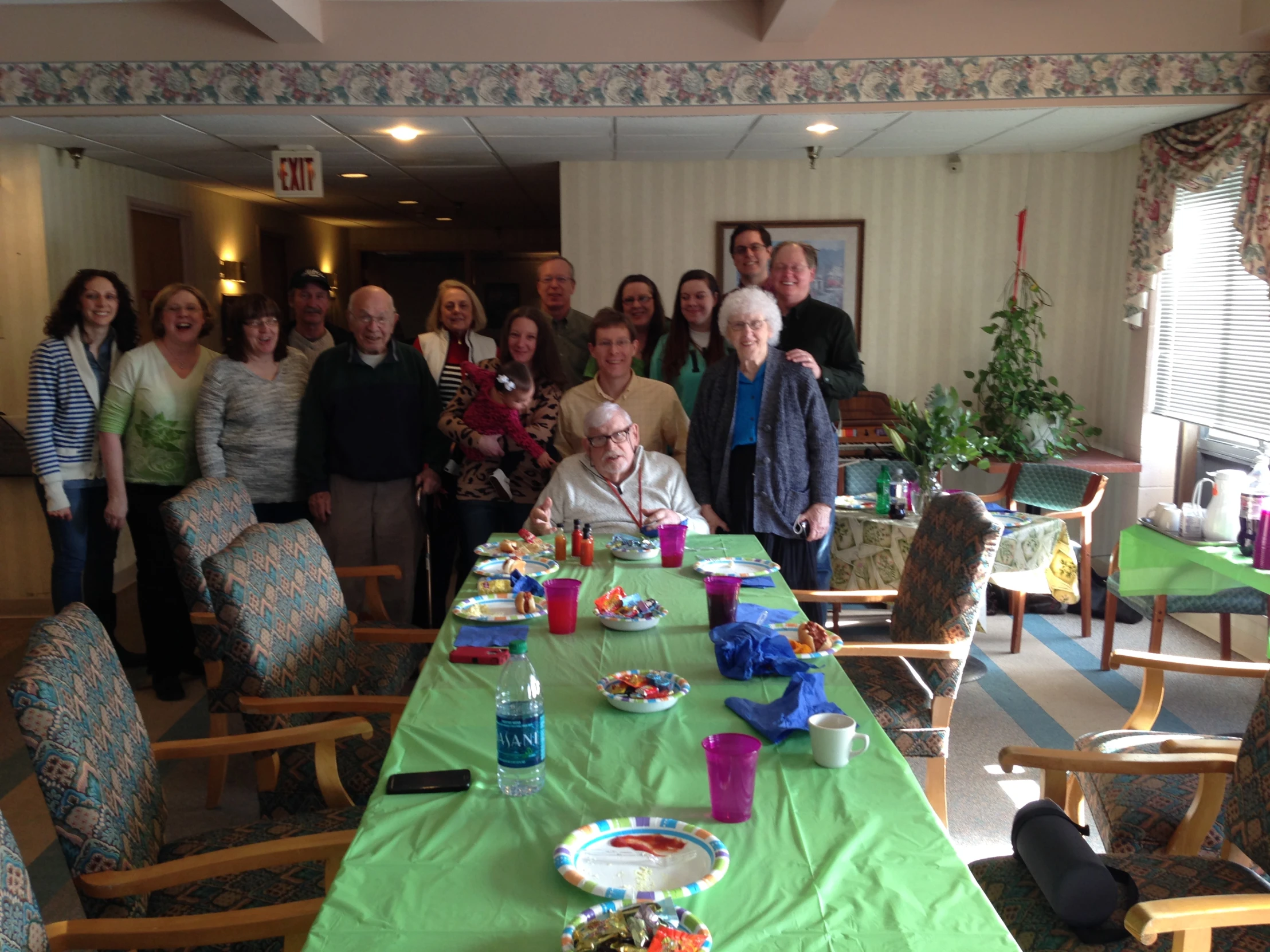 a group of people gathered at a table for a party