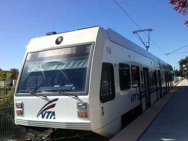 a passenger train is waiting on the train station