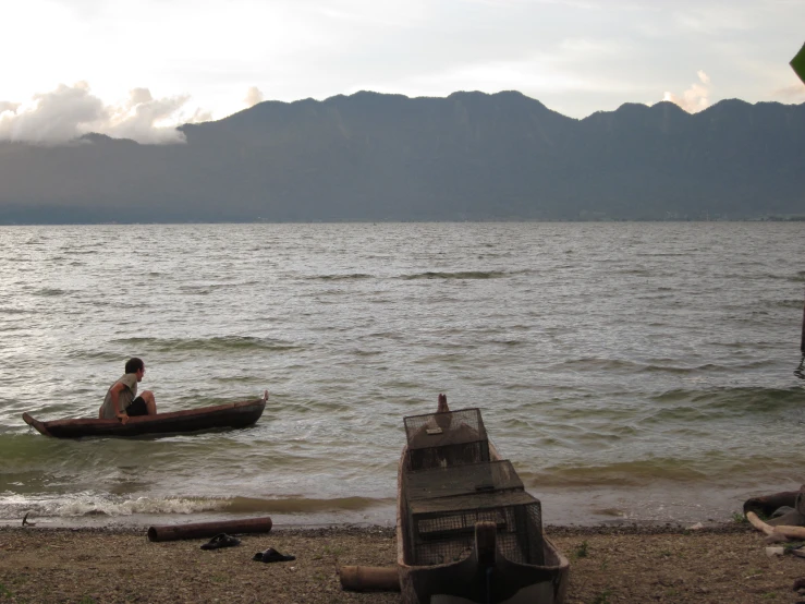 a person in a small boat on the water