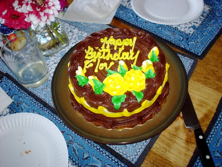 a brown and yellow cake on a blue table