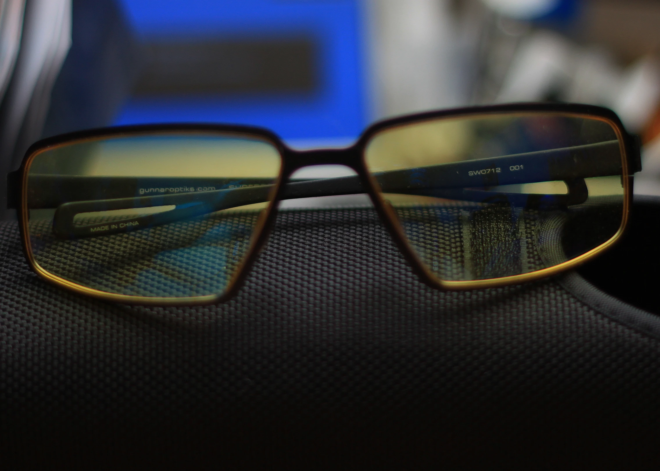 a pair of glasses are shown on top of a table
