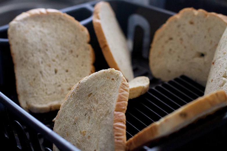 slices of bread sitting in a food processor