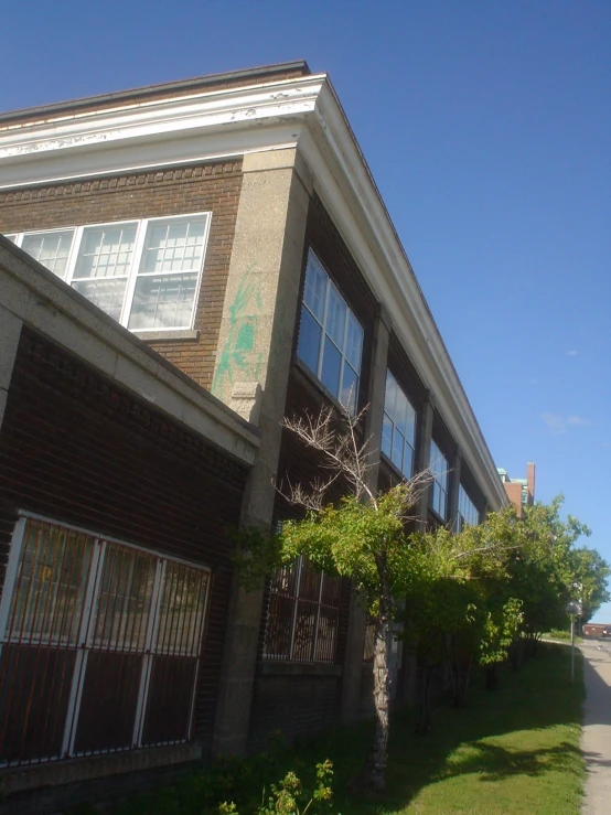 an image of a street going by a brick building