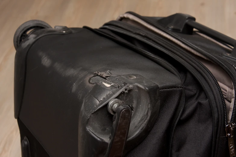 a suitcase with one handle and several handles
