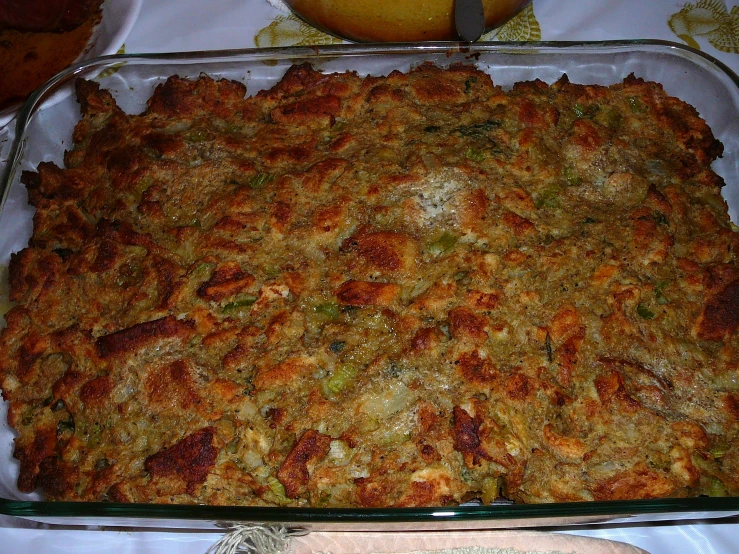 a casserole is displayed in glass dish on the table