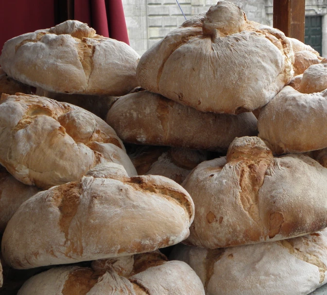 a stack of white bread with multiple grains in it