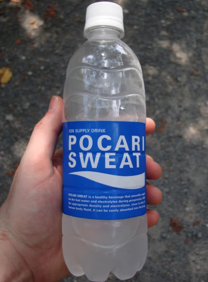 a bottle of pocari sweat being held in hand