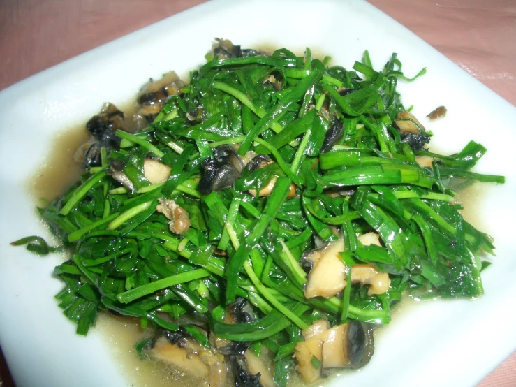 cooked vegetables are piled on the plate ready to be eaten