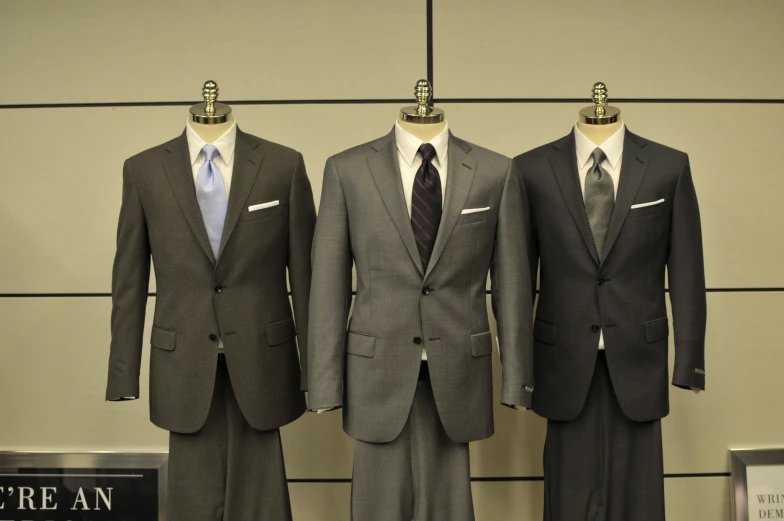 three men's suits in three different colors