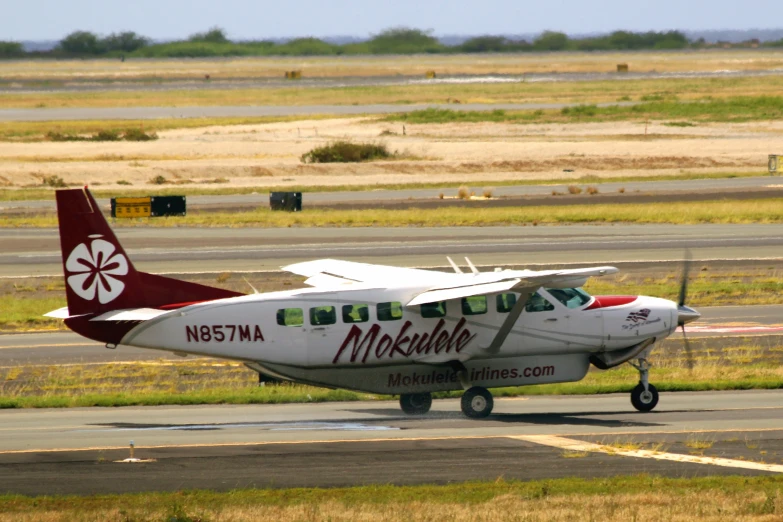 a small plane is sitting on the runway