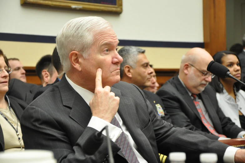 several military men are in a meeting looking upward