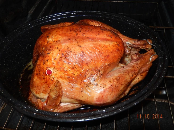 a turkey is being roasted in an oven