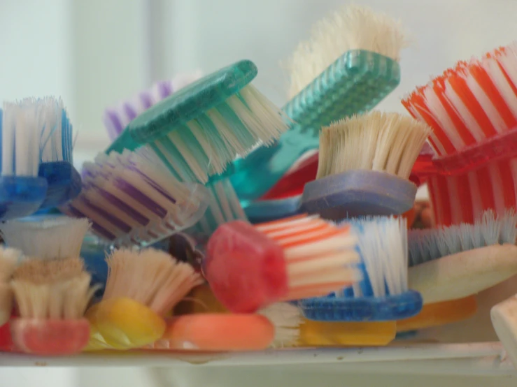 lots of tooth brushes on the table