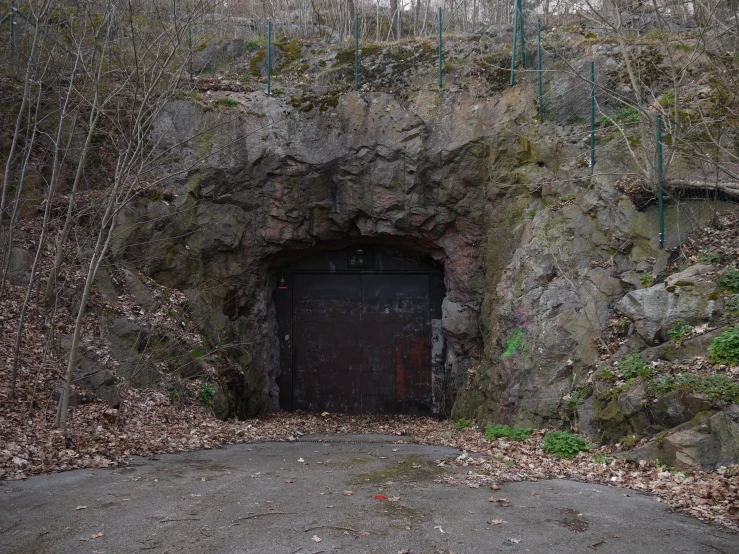 an old tunnel with a door in the middle