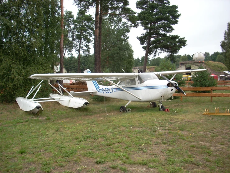 an airplane on the ground in the grass