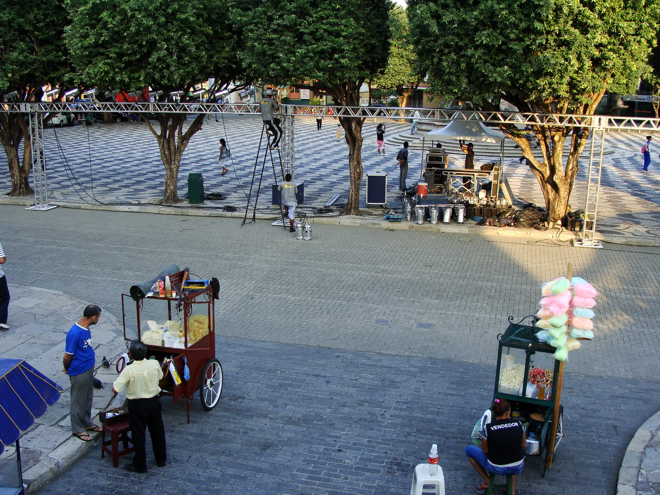 a beach has people standing outside and talking