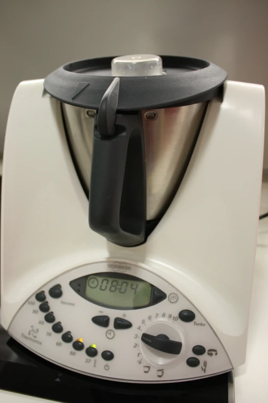 this is a kitchen equipment mixer with timer on the top of it