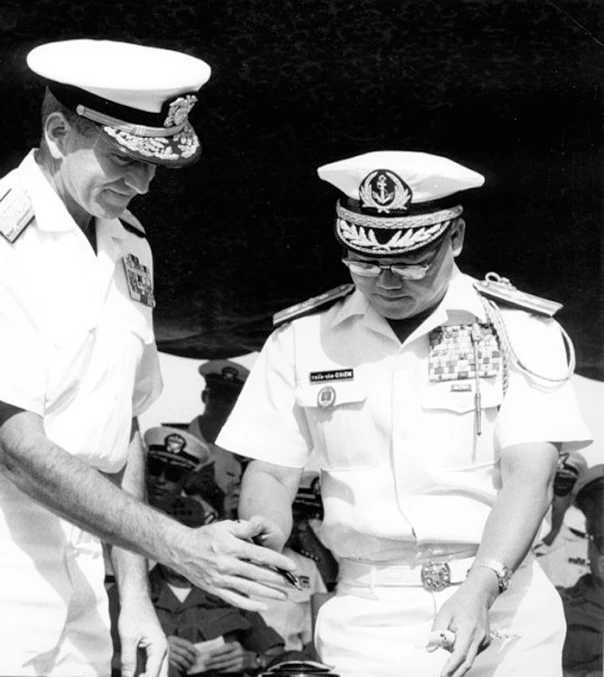 a sailor shows another captain soing to his wallet