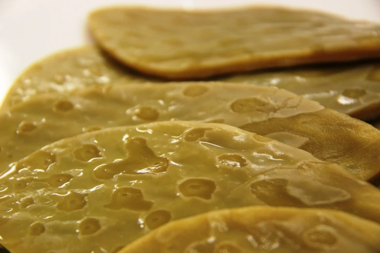 three slices of melon covered in jelly on top of each other