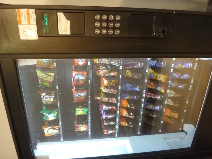 an automatic vending machine that has many flavors on display