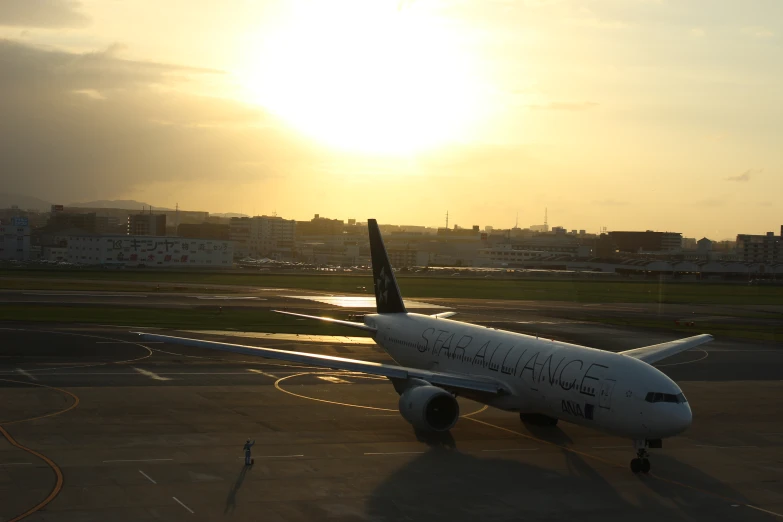 a jetliner sitting on top of an airport runway