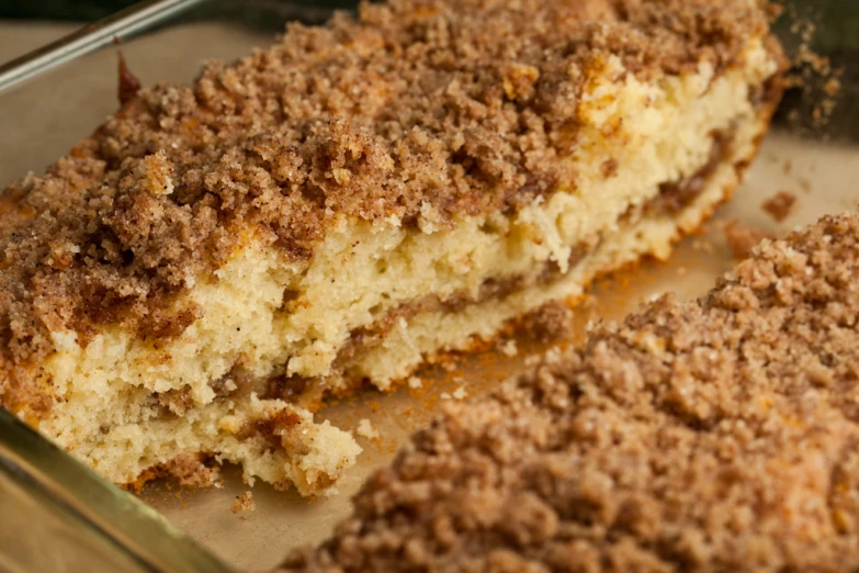 pieces of cake sitting in a baking pan on a table