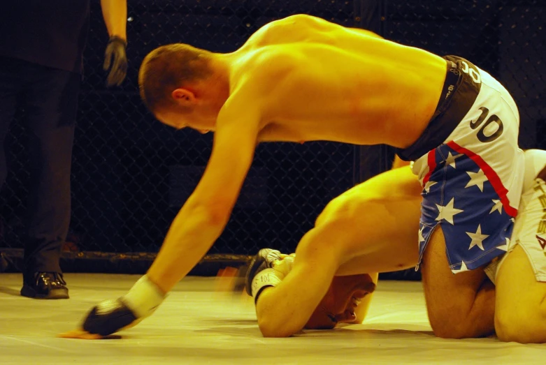 an image of a wrestler taking off his leg