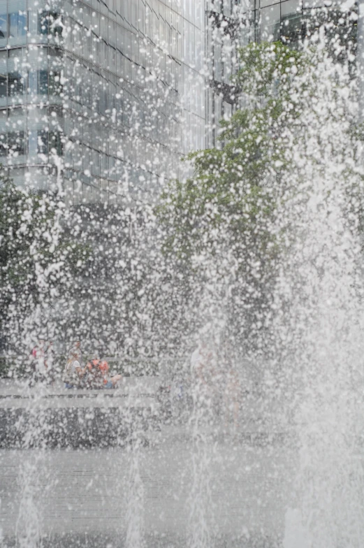 the water shoots out from the hydrant spraying in the air