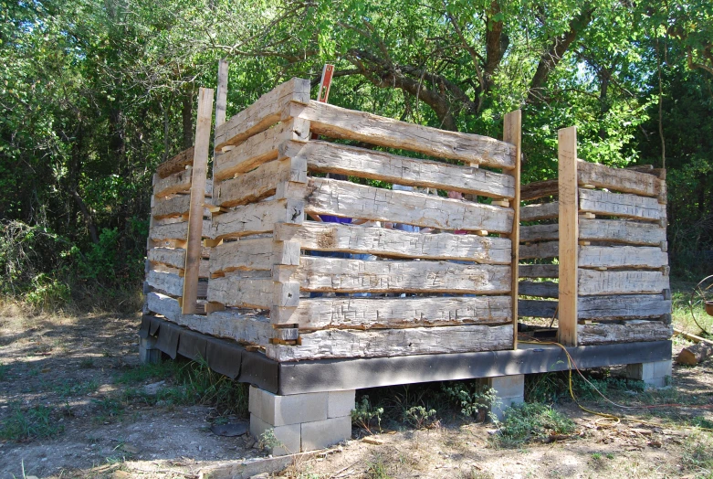 the two large pieces of wood are stacked up