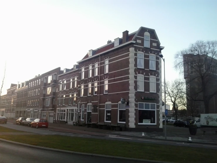 a very old brick building on a city street