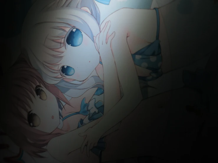 two anime women hugging in a bed while one woman stares at the viewer