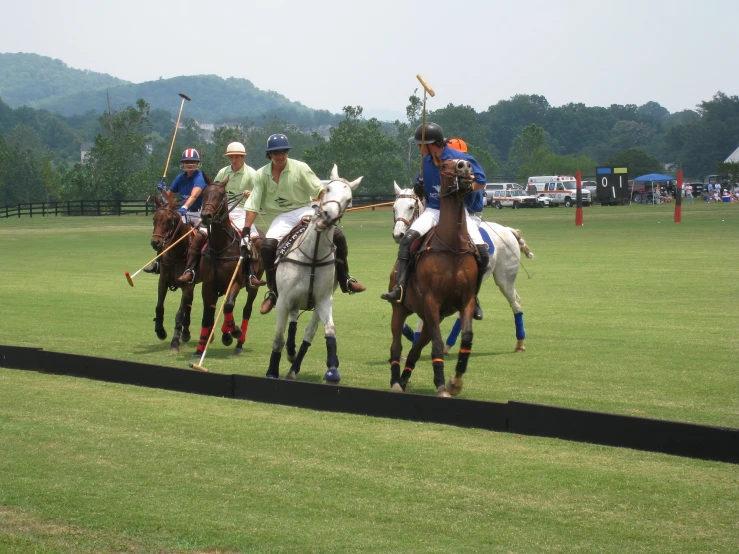 the polo team is wearing blue uniforms