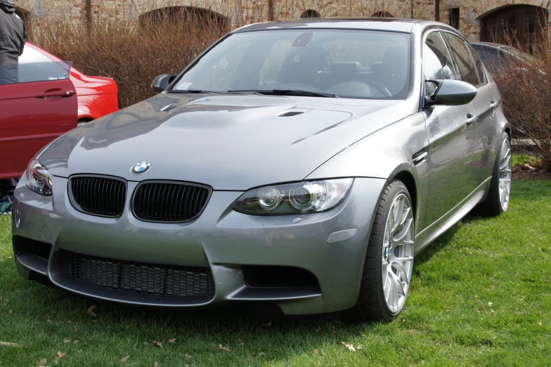 a car that is parked on some grass