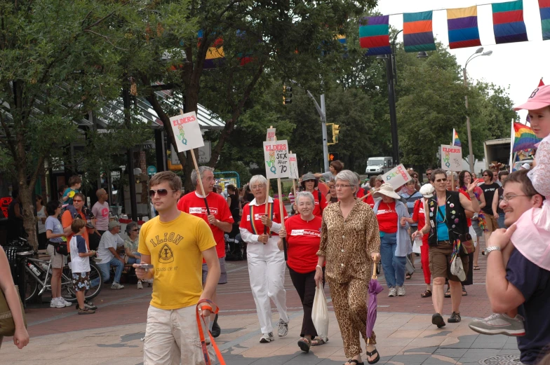 a crowd of people are walking on the street together